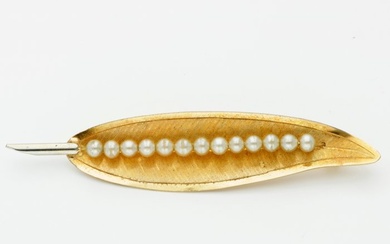 Yellow gold brooch set with 13 freshwater pearls. The brooch...