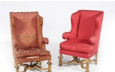 A companion pair of carved giltwood and upholstered wing armchairs