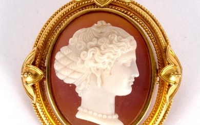 A late Victorian stone cameo brooch, the carved stone