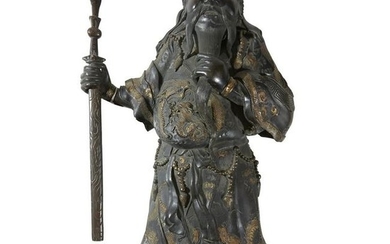 A Chinese style parcel-gilt bronze guardian figure