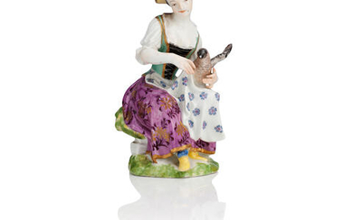 A Meissen figure of a seated lady, probably later decorated