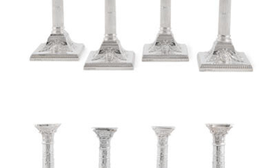 A set of four George V silver Corinthian column candlesticks