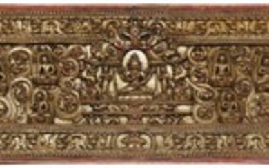 A CARVED AND POLYCHROME WOOD BOOK COVER Tibet, Circa 14th Century