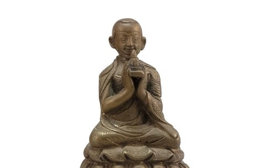 SINO-TIBETAN BRONZE FIGURE OF A SEATED LAMA Holding a stupa and resting on a lotus throne. Height 3".