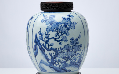 A 19th century Chinese porcelain urn, underglaze blue, with a later cut openwork wooden lid.