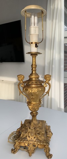 A 19th century gilded bronze table lamp. H. 60 cm. W. 15 cm.