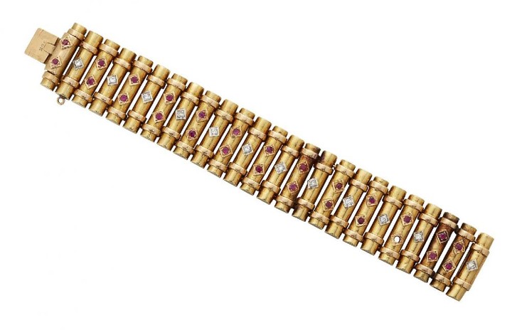 A 20th century gold, Egyptian bracelet, designed...