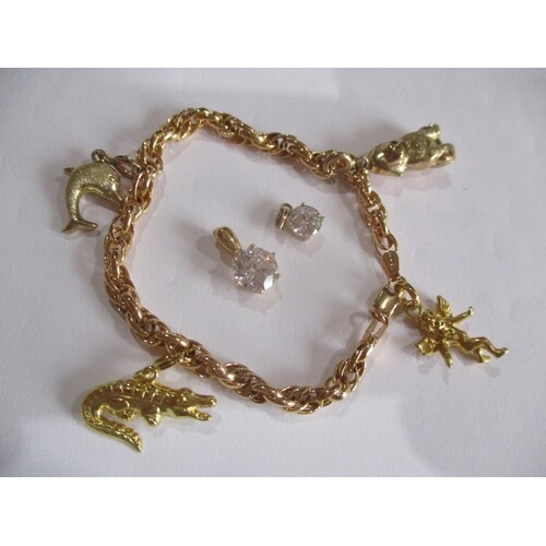 THIS LOT HAS BEEN WITHDRAWN A 9ct gold charm bracelet with ...