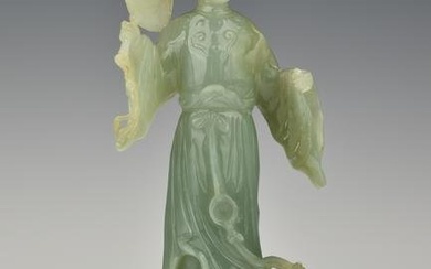 A CHINESE QING DYNASTY CARVED LIGHT CELADON JADE FEMALE FIGURINE