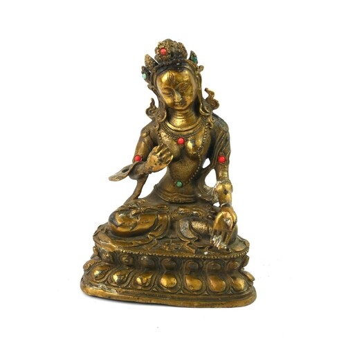 A CHINESE TIBETAN GILT BRONZE AND CORAL FIGURE OF BODHISATTV...