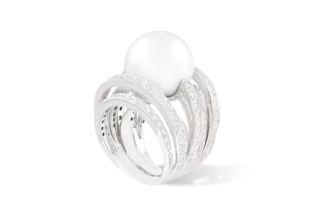A CULTURED PEARL AND DIAMOND COCKTAIL RING Of...