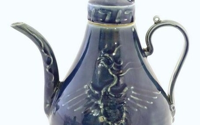 A Chinese pear shaped teapot with phoenix bird