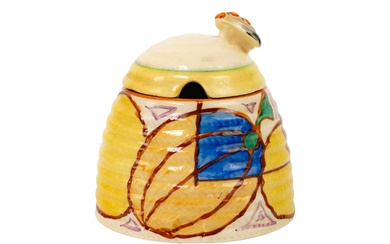 A Clarice Cliff Melon pattern beehive honey pot and matched cover.