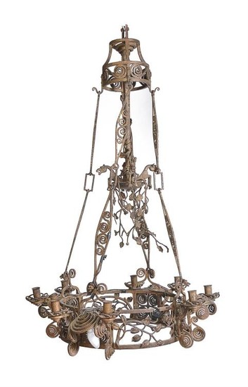 A Continental, possibly French, wrought iron eight light chandelier loosely in Gothic taste