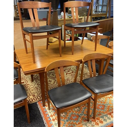 A Danish teak mid century extendable dining table together w...