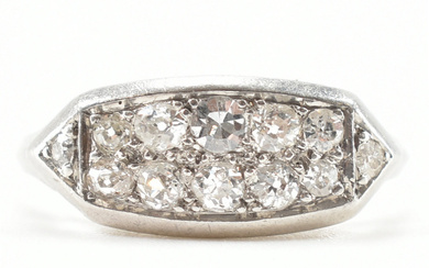 A French Art Deco platinum and diamond ring. The ring set with two rows of old cut diamonds to a rectangular head with pieced gallery to plain shank. Weight 4.52g. Size N.