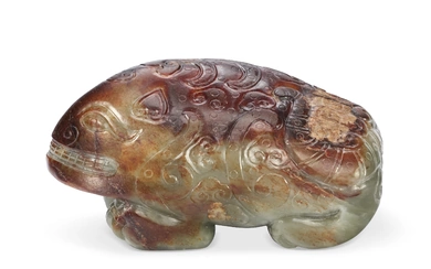 A GREEN AND RUSSET JADE FIGURE OF A RECUMBENT MYTHICAL BEAST CHINA