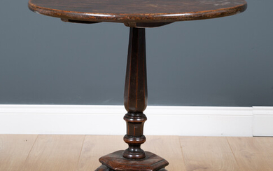 A George III country made mahogany circular tilt top occasional...