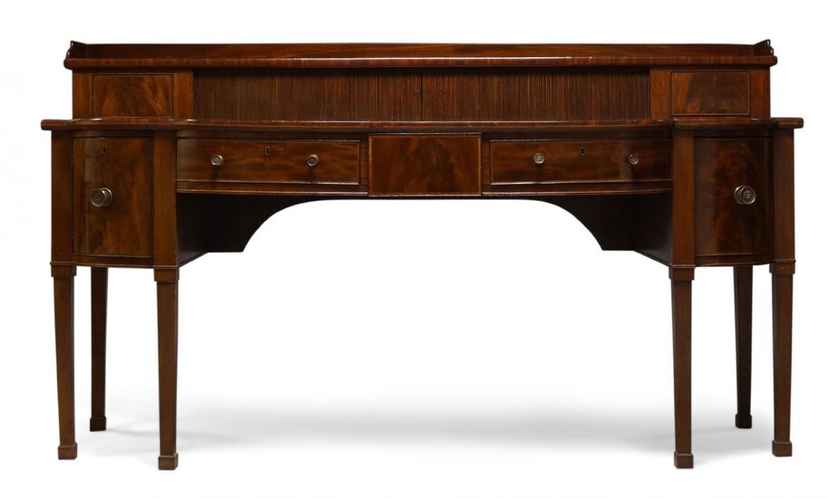 A George III mahogany and crossbanded serving table, the top...