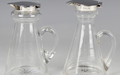 A George V silver mounted cut glass conical whiskey tot with loop handle, Birmingham 1916 by S. Blan