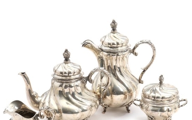 A German 20th century silver tea and coffee set comprising a teapot, coffee pot and a sugar and cream set. H. 8.5–27 cm. (4)