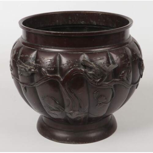 A Japanese Meiji period patinated bronze planter of lobed fo...