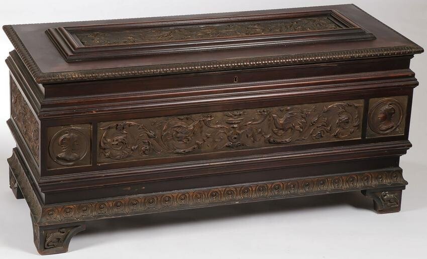 A LARGE CARVED CHEST