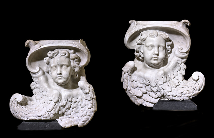 A PAIR OF BAROQUE CARVED MARBLE ANGEL CORBELS