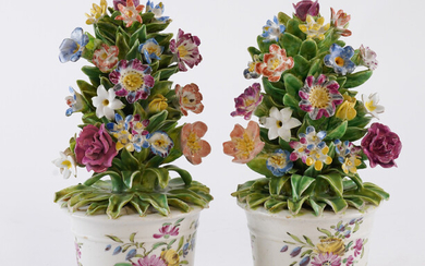 A PAIR OF BOW TUBS OF FLOWERS (2)