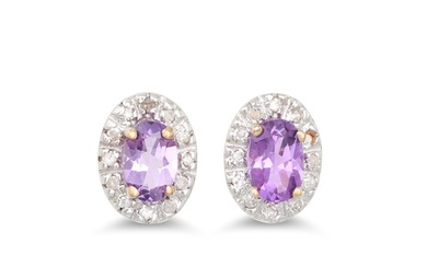 A PAIR OF DIAMOND AND AMETHYST CLUSTER EARRINGS, the oval am...