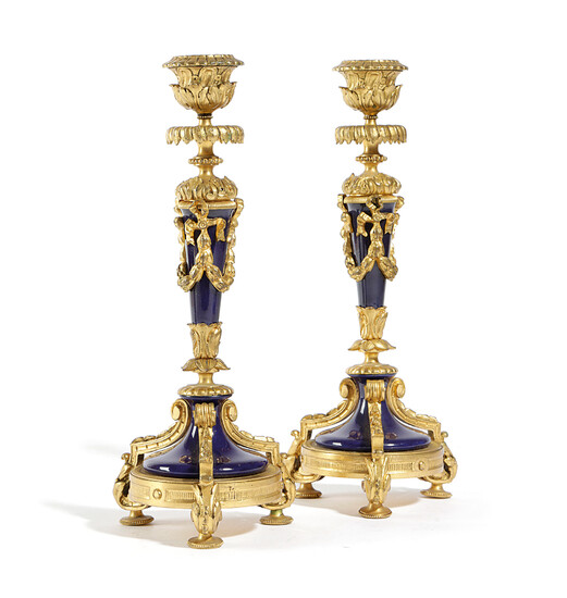 A PAIR OF FRENCH NAPOLEON III ORMOLU AND PORCLELAIN CANDLESTICKS