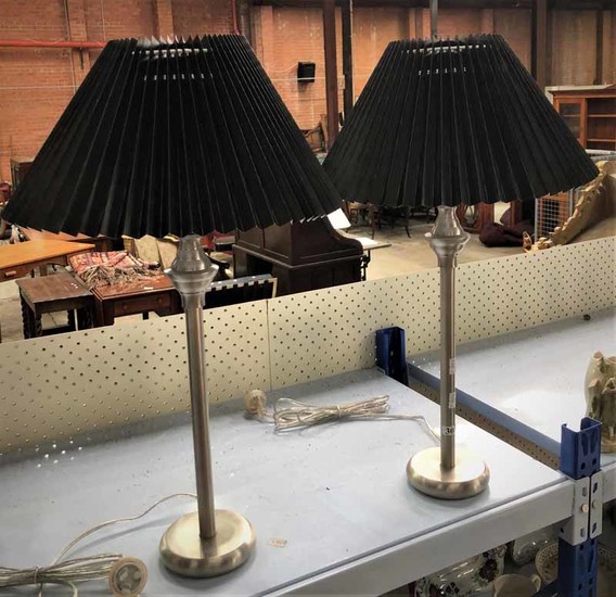 A PAIR OF MATTE CHROME TUBE STYLE ROUND BASE LAMPS