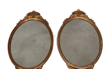 A PAIR OF OVAL CARVED GILTWOOD AND GESSO WALL MIRRORS, IN MID-18TH CENTURY STYLE.