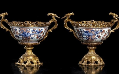 A PAIR OF OVERDECORATED IN EUROPE PORCELAIN BOWLS WITH
