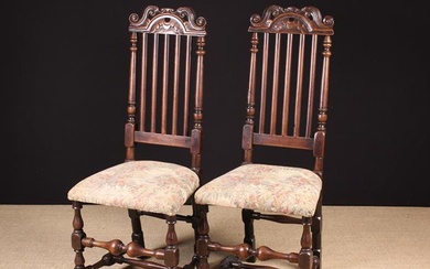 A Pair of 18th Century Slat Back Walnut Side Chairs. The pierced cresting rails carved with voluted