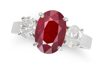 A RUBY AND DIAMOND THREE STONE RING set with an oval cut ruby of 2.74 carats, accented on each side