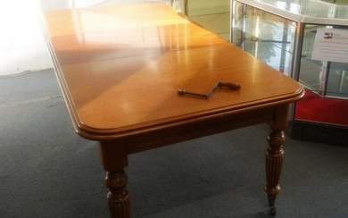 A VICTORIAN STYLE MAHOGANY EXTENDING DINING TABLE, by