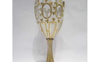 A Victorian glass goblet vase with white and gilt floral lea...