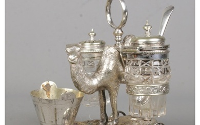 A Victorian novelty silver plated cruet set formed as a came...