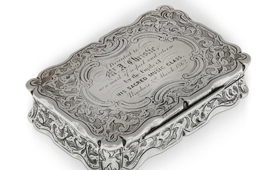 A Victorian silver snuff box, Birmingham, 1860, Frederick Marson, of shaped rectangular form, the lid with presentation engraving dated 1862, the body chased throughout with foliate scroll decoration, 5.3 x 8cm, approx. weight 4.3oz