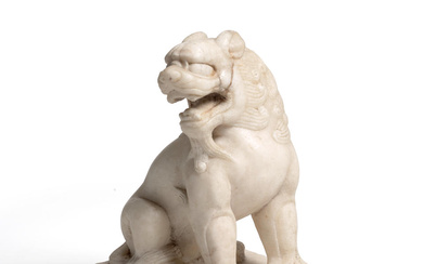 A WHITE MARBLE FIGURE OF SEATED LION Tang Dynasty, 7th-8th...