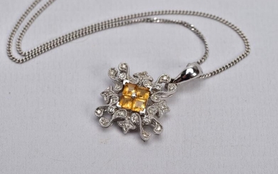 A WHITE METAL CITRINE AND DIAMOND PENDANT NECKLACE, the...
