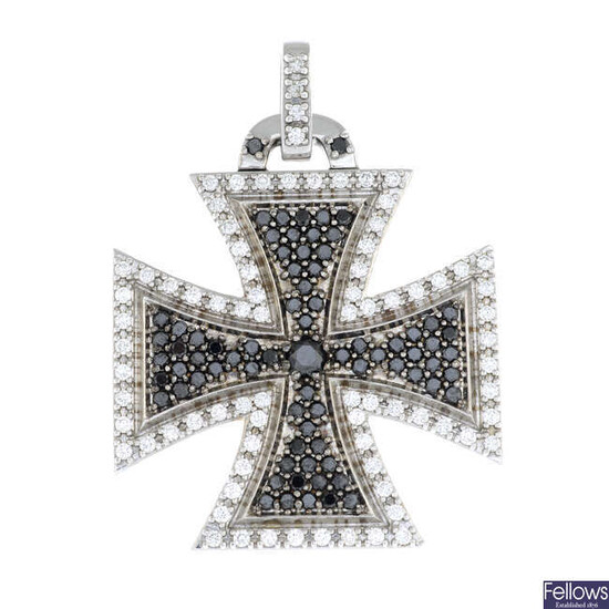 A brilliant-cut diamond and black gem cross pendant.