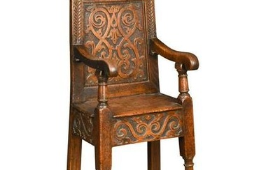 A carved oak high chair, in the 17th century style