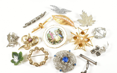 A collection of costume jewellery brooch pins. The brooches to include a signed Bond Boyd rhinestone set maple leaf brooch pin, gold tone silver tone marcasite, silver Thai spirit lantern brooch pin, a nephrite maple leaf, Coalport pictorial brooch...