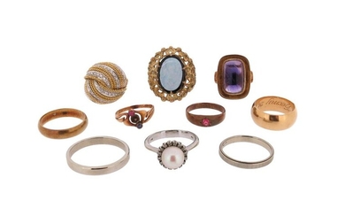 A collection of ten rings, including an amethyst-set gold ring,...