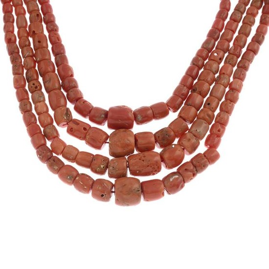 A coral four-row bead necklace.Clasp stamped 750.Length