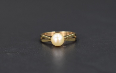 A cultured pearl solitaire ring, having pierced geometric style shoulders on a 9ct gold shank