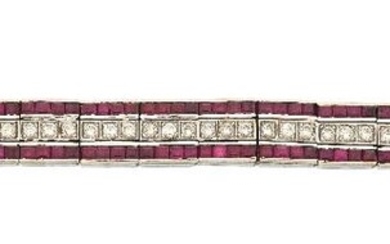 A diamond and ruby flexible bracelet, designed as series of articulated diamond three stone and calibre ruby rectangular panels, stamped 750, approx. length 17.5cm