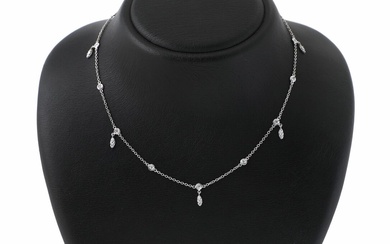 A diamond necklace set with numerous brilliant-cut diamonds weighing a total of...